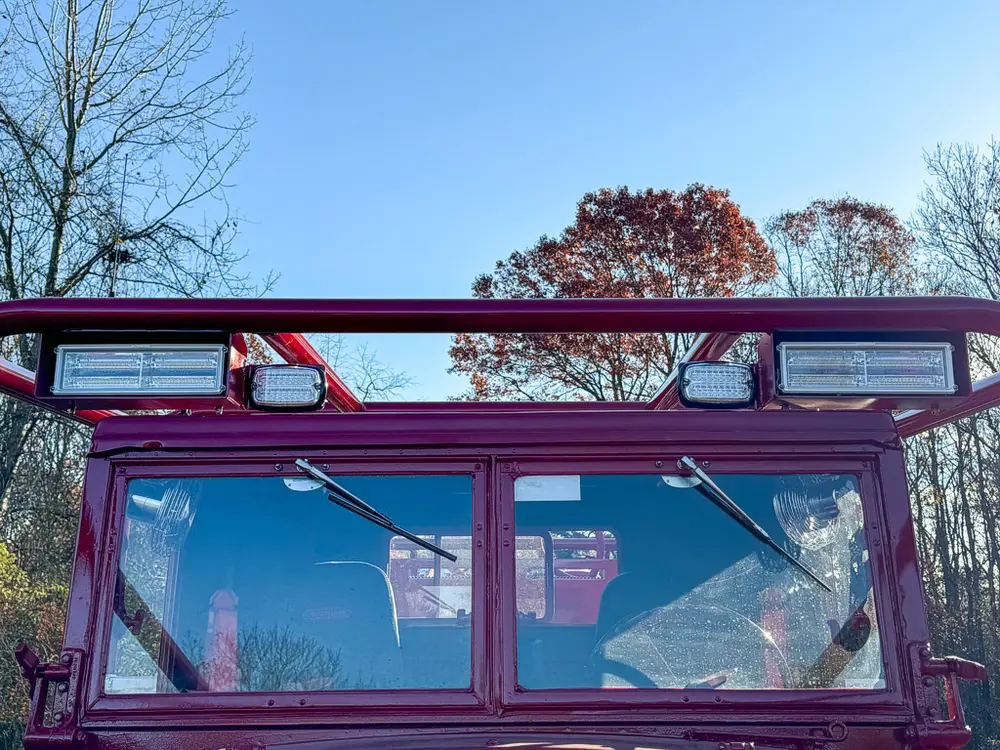 Upper windshield frame and roof light housing close-up.
