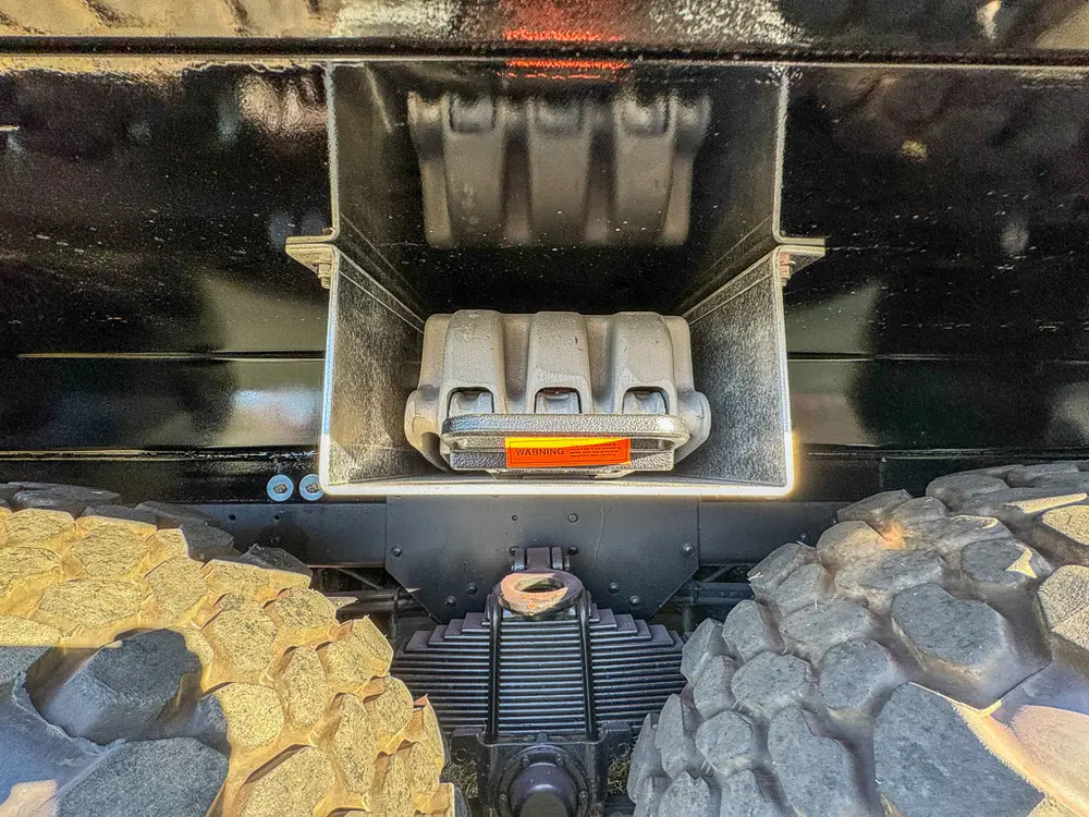 Underside rear close-up showing tow hitch receiver and hardware.