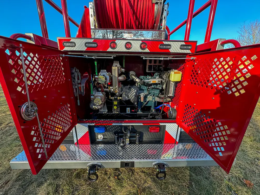 Open rear mesh doors revealing pump controls and piping.