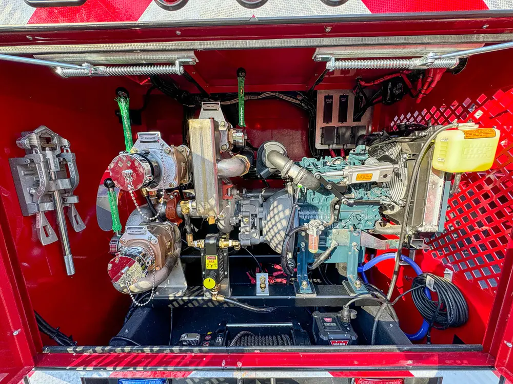 Pump assembly close-up showing valves, gauges, and plumbing.