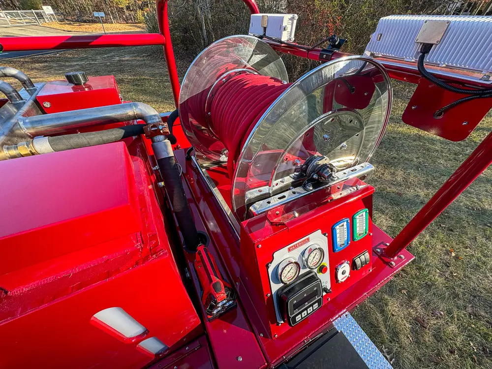 Upper deck workstation with mounted controls and transparent shield.