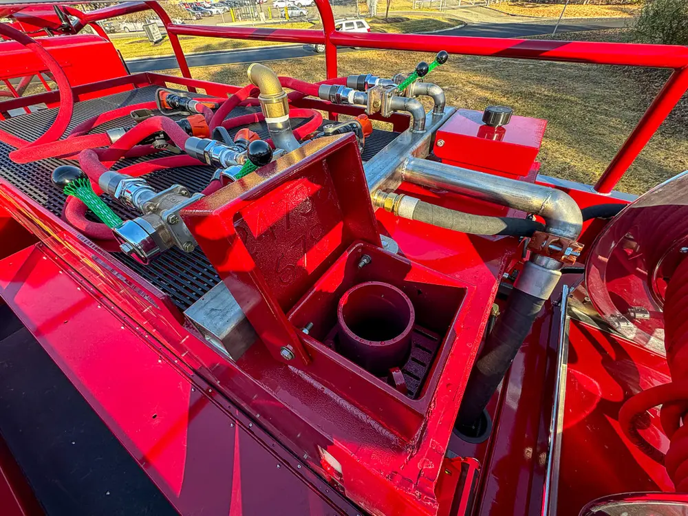 Top control area close-up with valve handles and large intake opening.