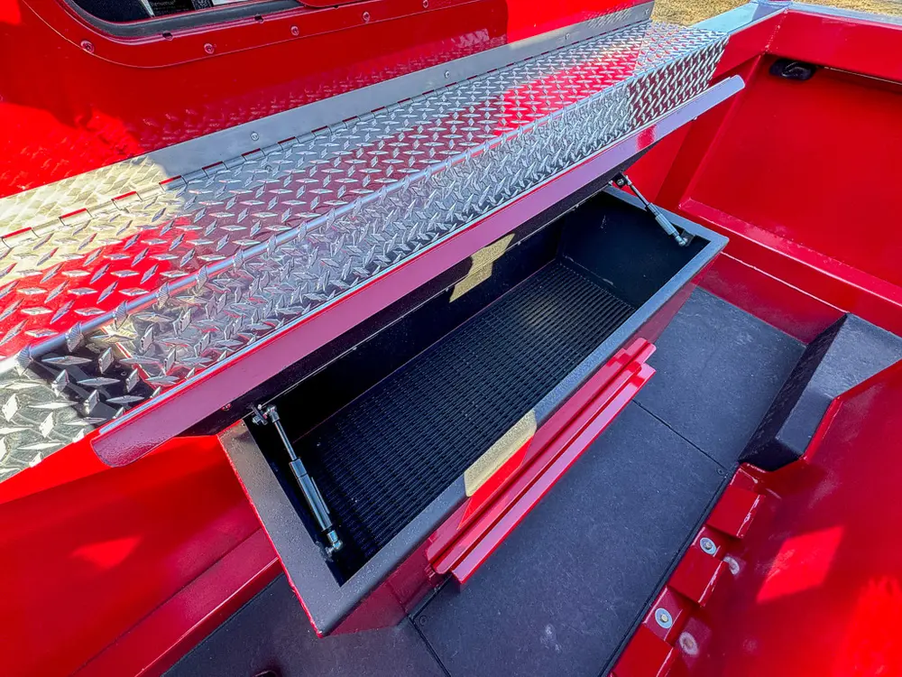 Open upper side compartment with long black storage tray.