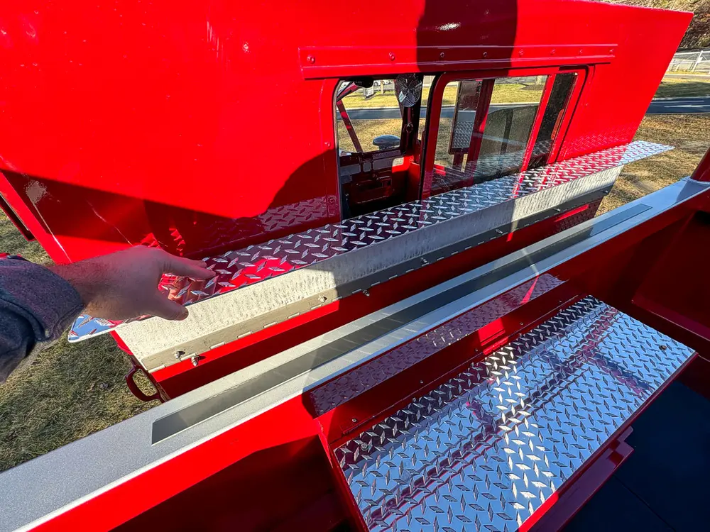 Open side hatch on upper body with dark interior storage space.