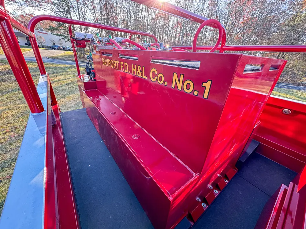 Upper side panel with Bayport Fire Co. No. 1 lettering on red bodywork.