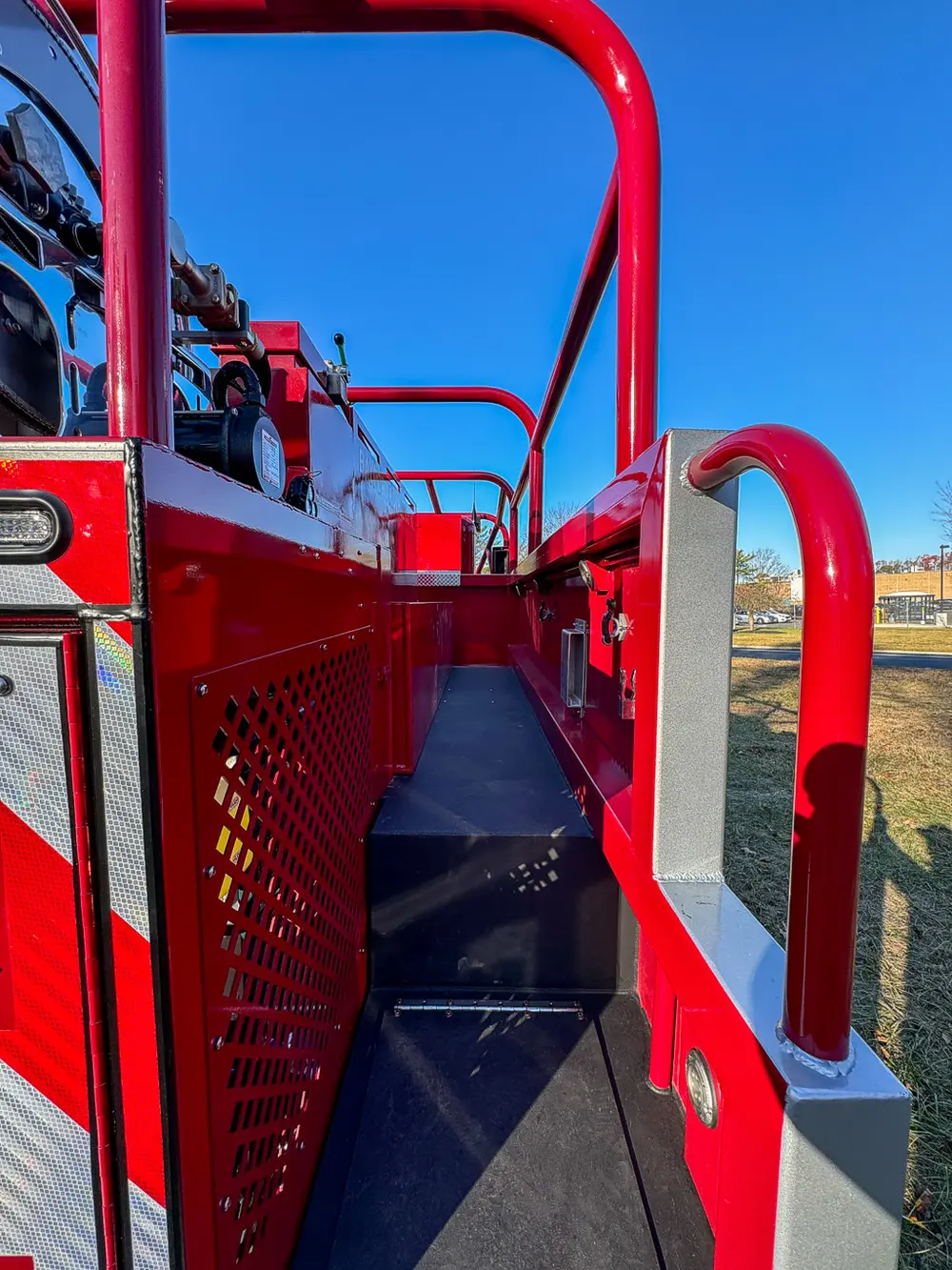 Upper walkway between rails viewed from rear toward the cab.