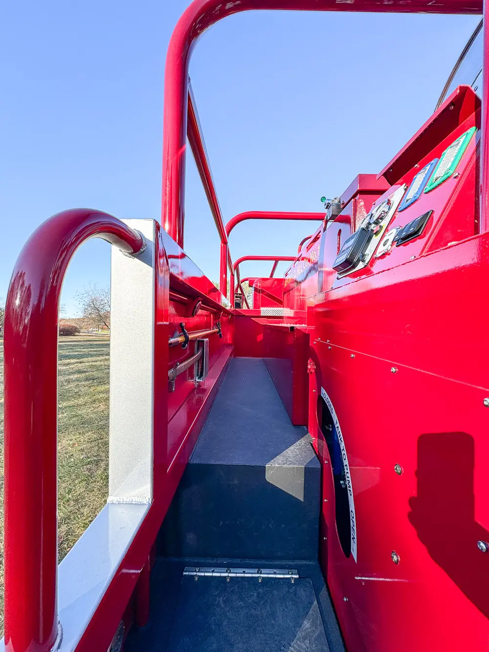 Upper side rail close-up along narrow walkway path.