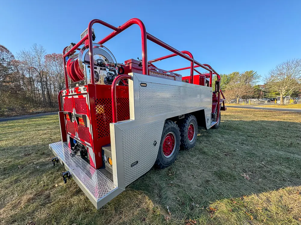 Rear-right three-quarter view showing side pod compartments and rear step.