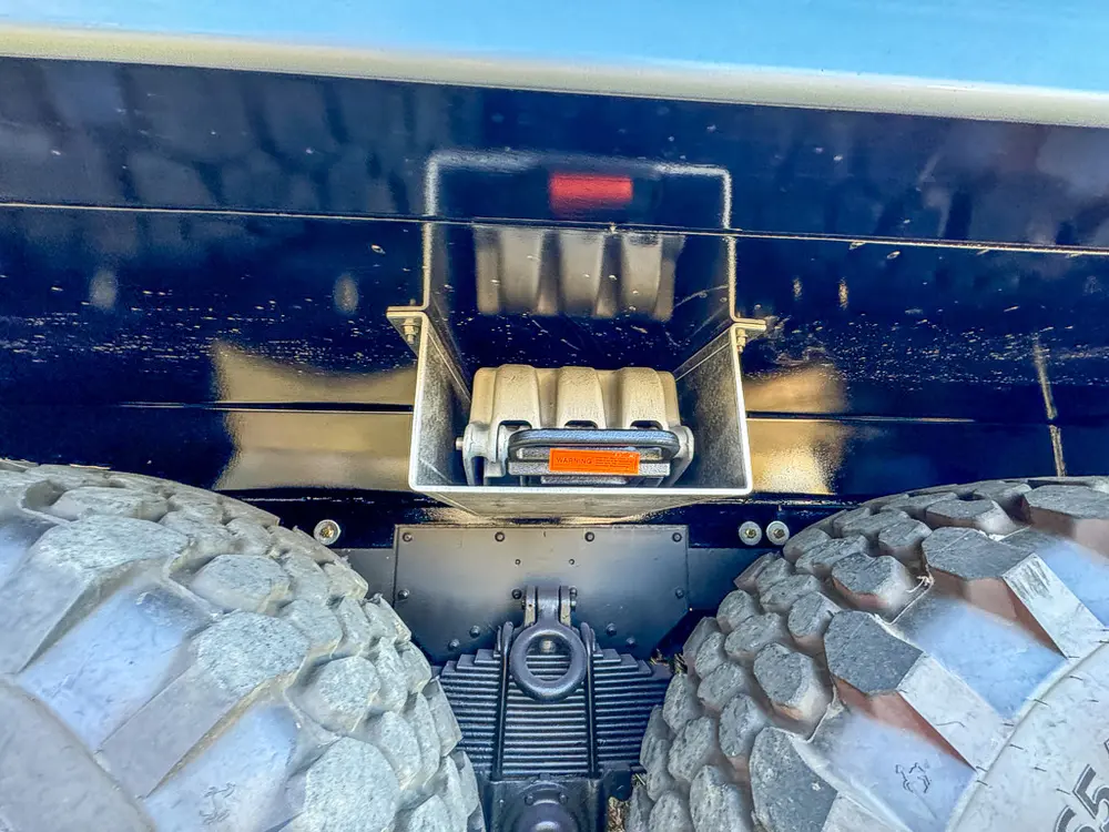 Underside close-up showing hitch receiver and rear frame structure.