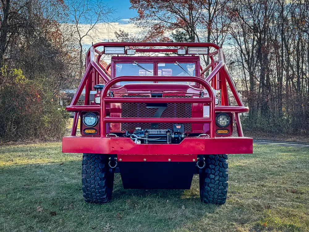 Head-on front view with bumper platform and grille mesh.