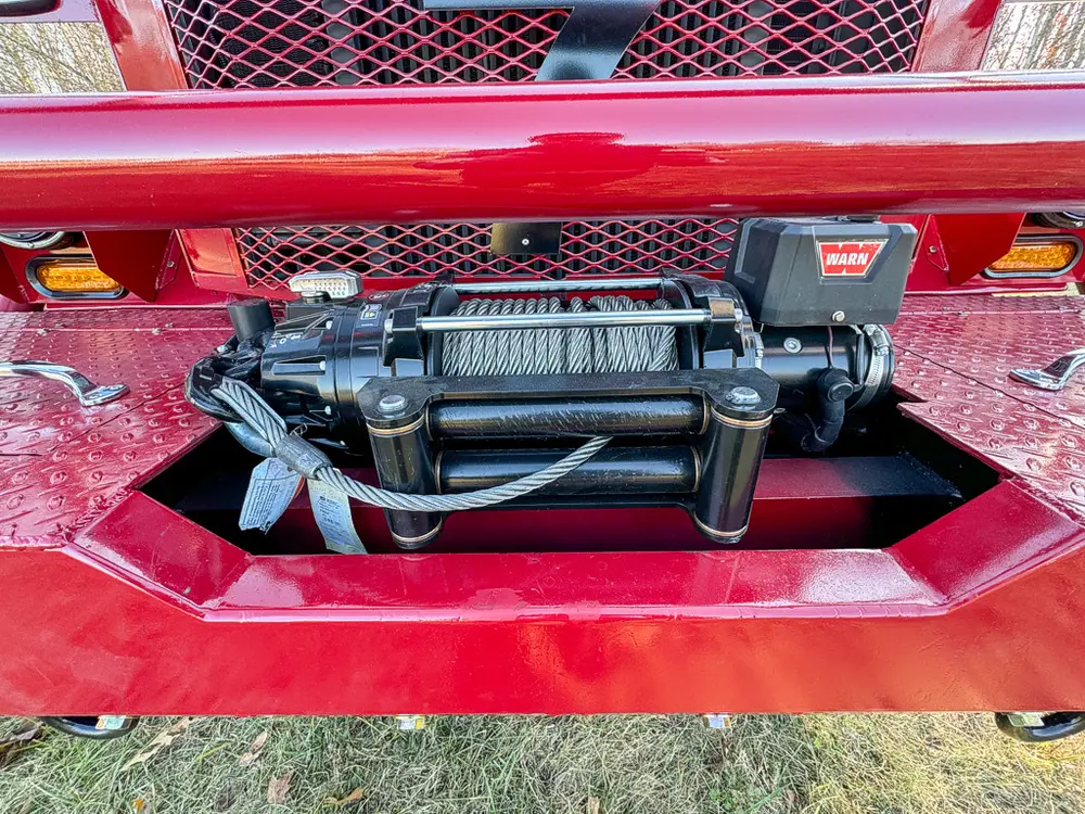 Front bumper compartment close-up with mounted winch assembly.