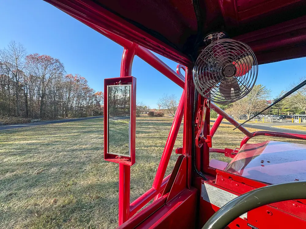 Side mirror and cab window close-up from inside the truck.