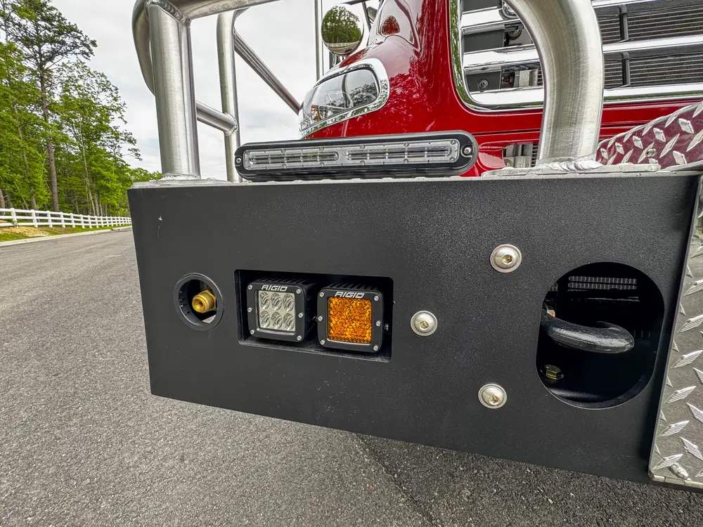 Wheel, tire, and suspension detail on apparatus, photo 208 of 303.