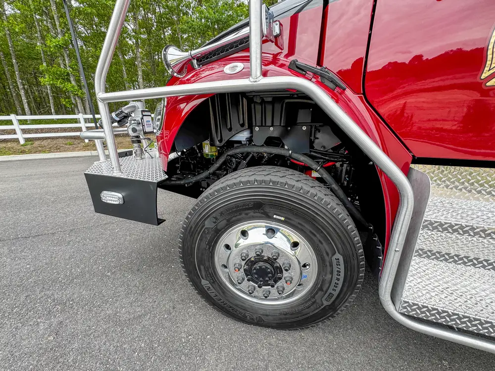 Driver-side profile of red brush apparatus outdoors, photo 212 of 303.