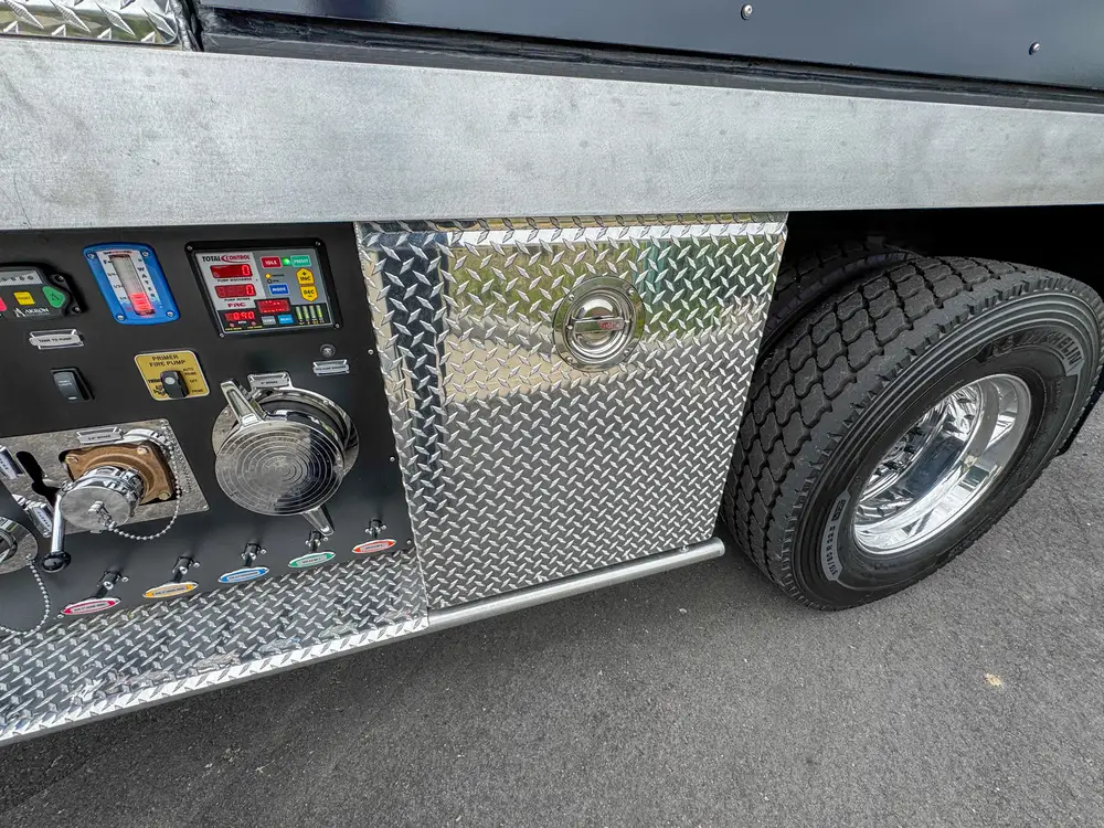 Driver-side profile of red brush apparatus outdoors, photo 222 of 303.