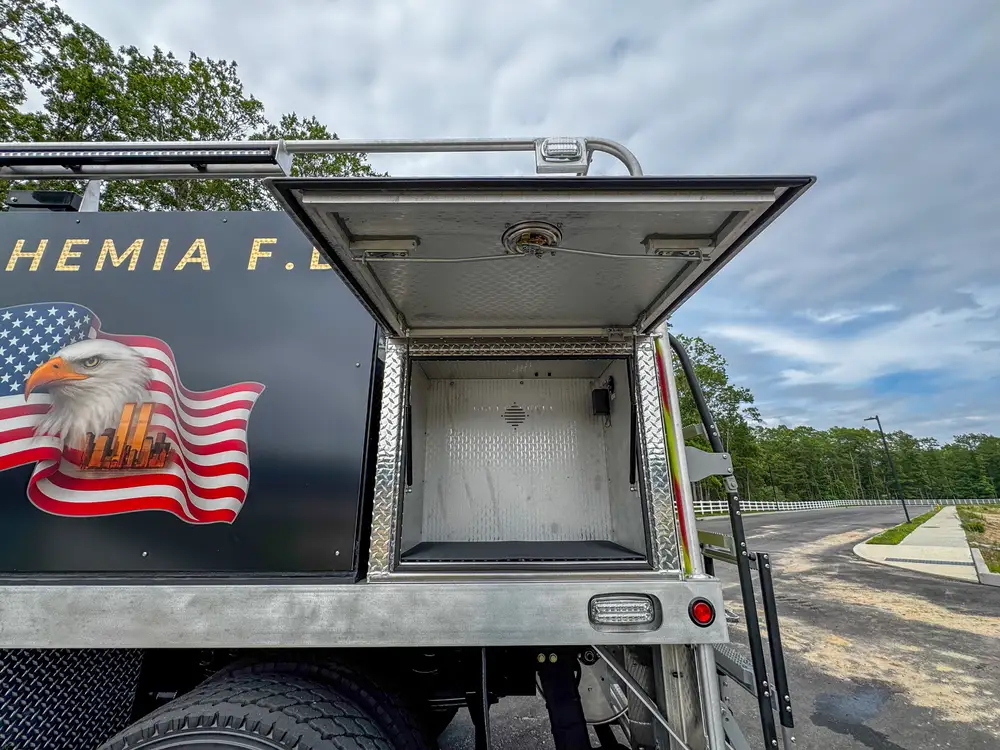 Open body compartment with storage area detail, photo 226 of 303.