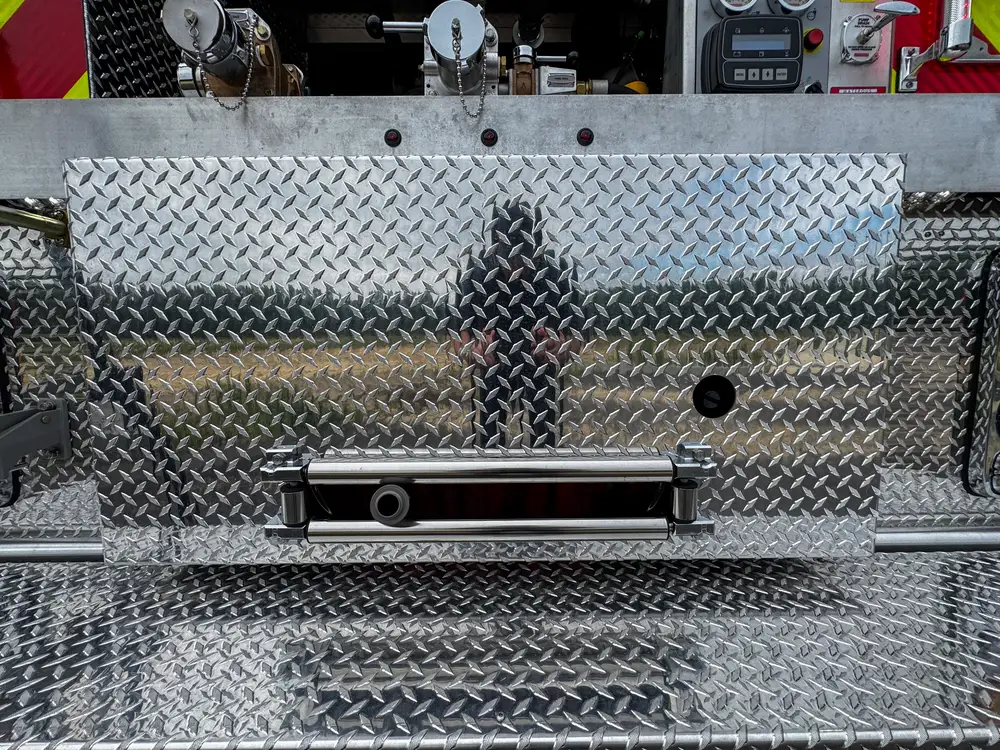 Driver-side profile of red brush apparatus outdoors, photo 232 of 303.