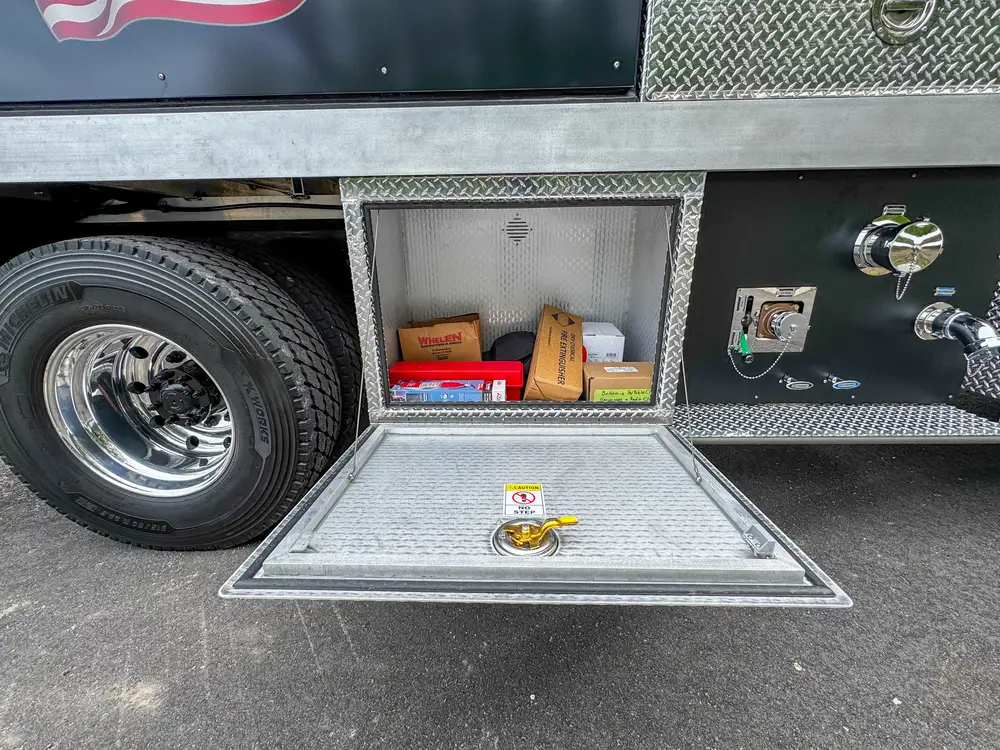 Driver-side profile of red brush apparatus outdoors, photo 242 of 303.