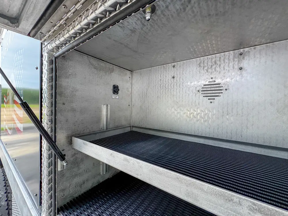 Open body compartment with storage area detail, photo 246 of 303.