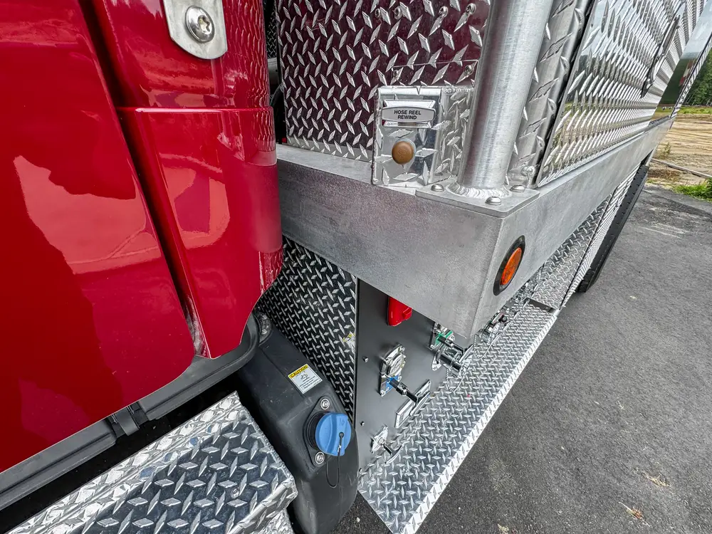 Driver-side profile of red brush apparatus outdoors, photo 252 of 303.