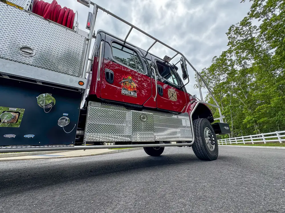 Diamond-plate body trim and step detail outdoors, photo 269 of 303.