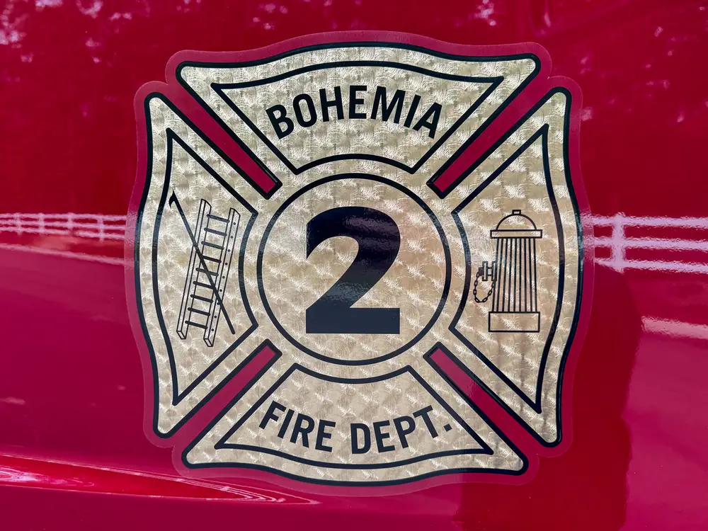 Driver-side profile of red brush apparatus outdoors, photo 302 of 303.