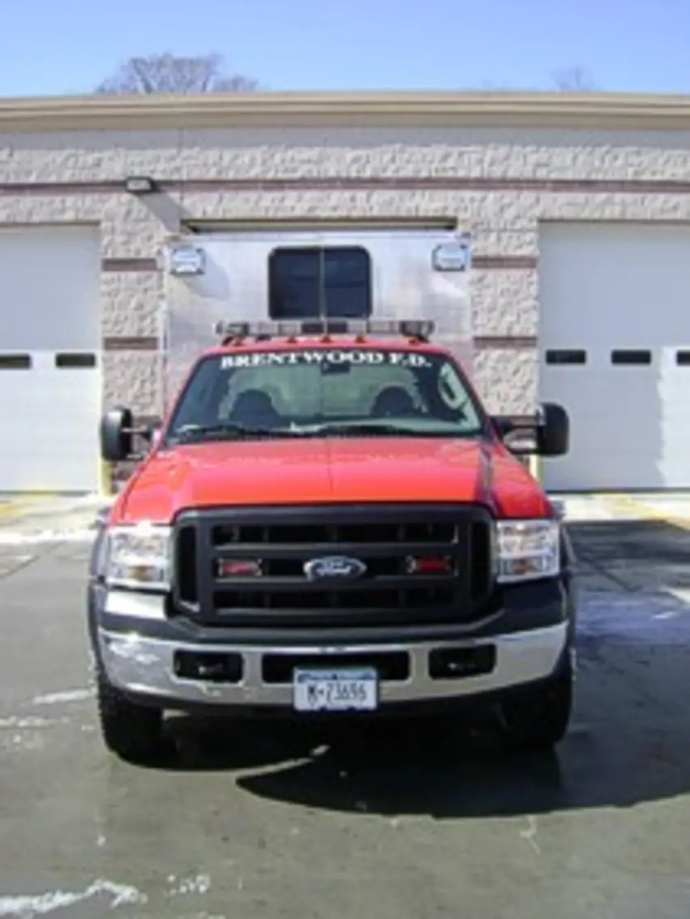 Rear seating and interior aisle view from open rear door.