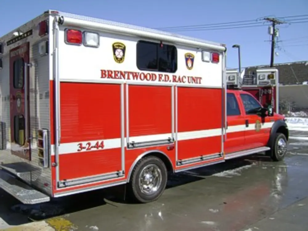 Passenger-side rear three-quarter view of rehab unit body.
