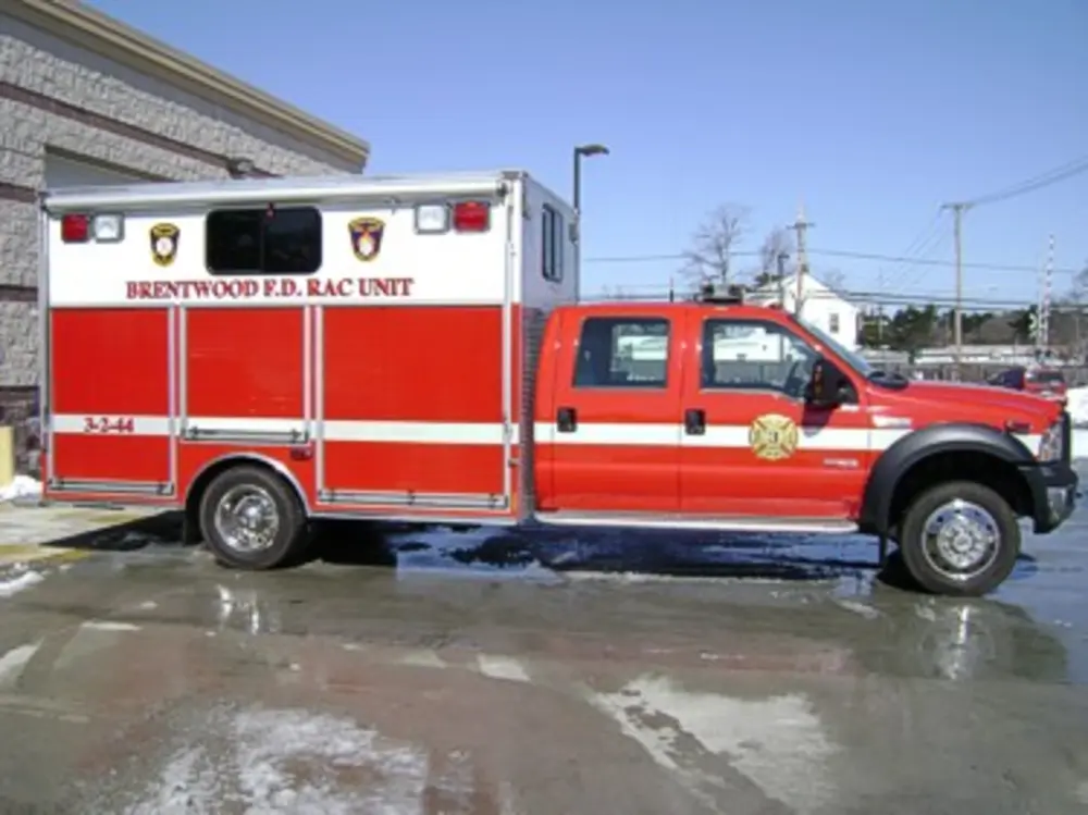 Passenger-side profile with compartment doors and striping.