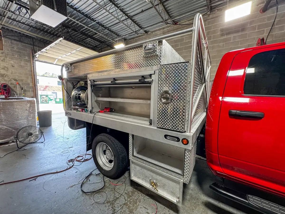 Left-side body view showing the open shelf compartment and lower compartment door below the shelf.