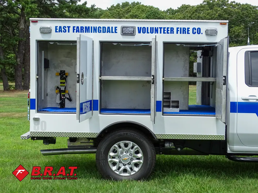 Open side compartments with shelves and blue floor lining.