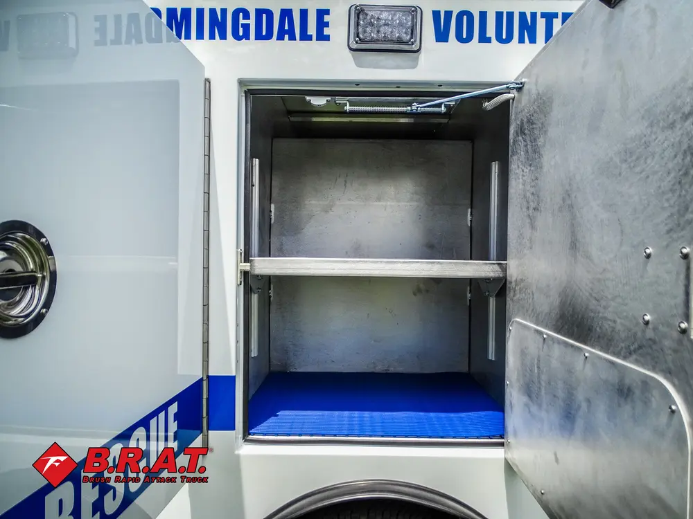 Open compartment showing upper shelf and lower cubby.