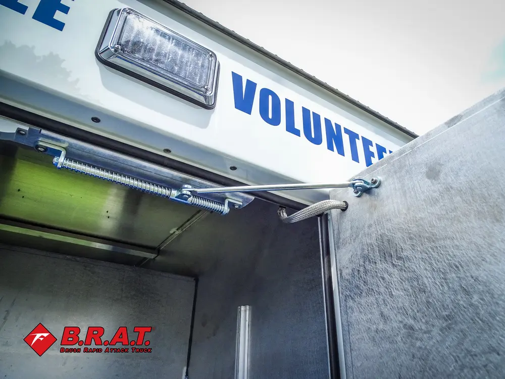 Compartment top edge and scene light close-up near lettering.