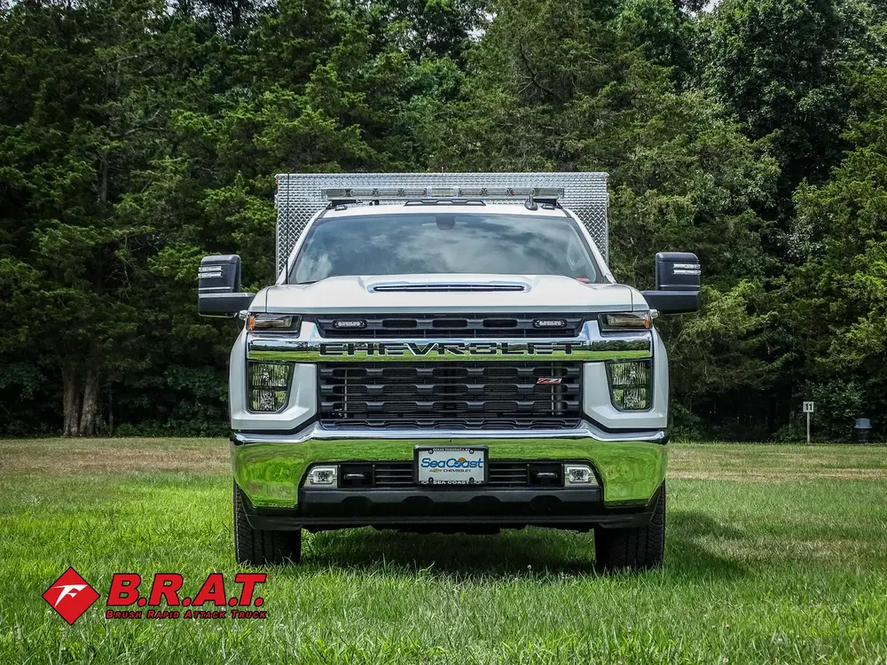 Head-on front view with grille and roof light bar.