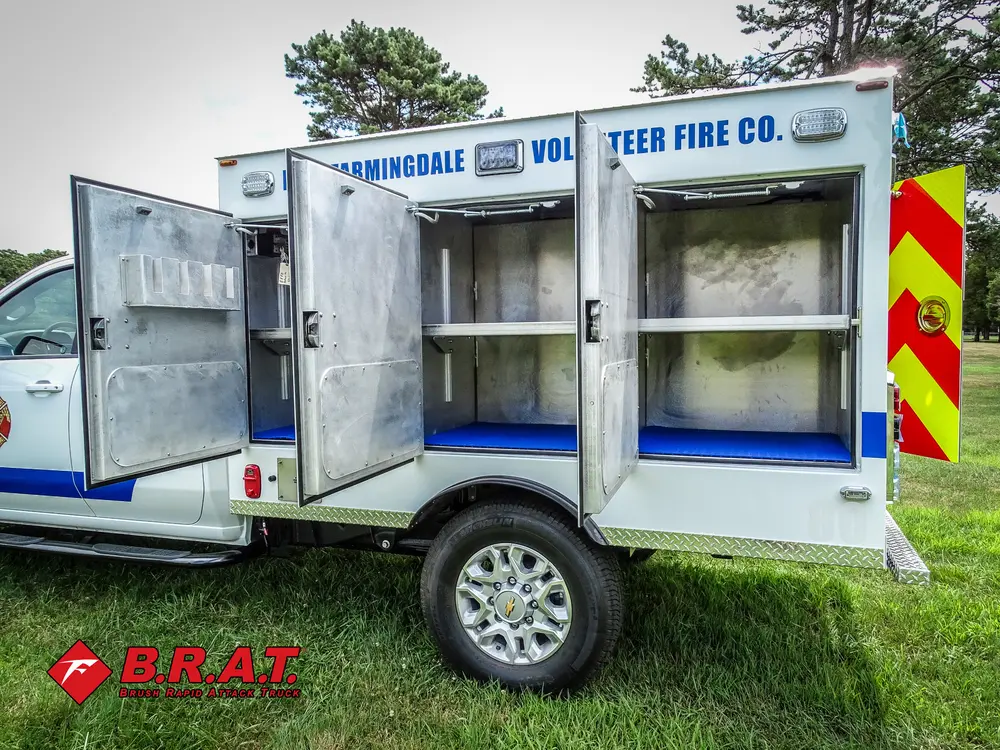 Passenger-side view with multiple compartment doors open.