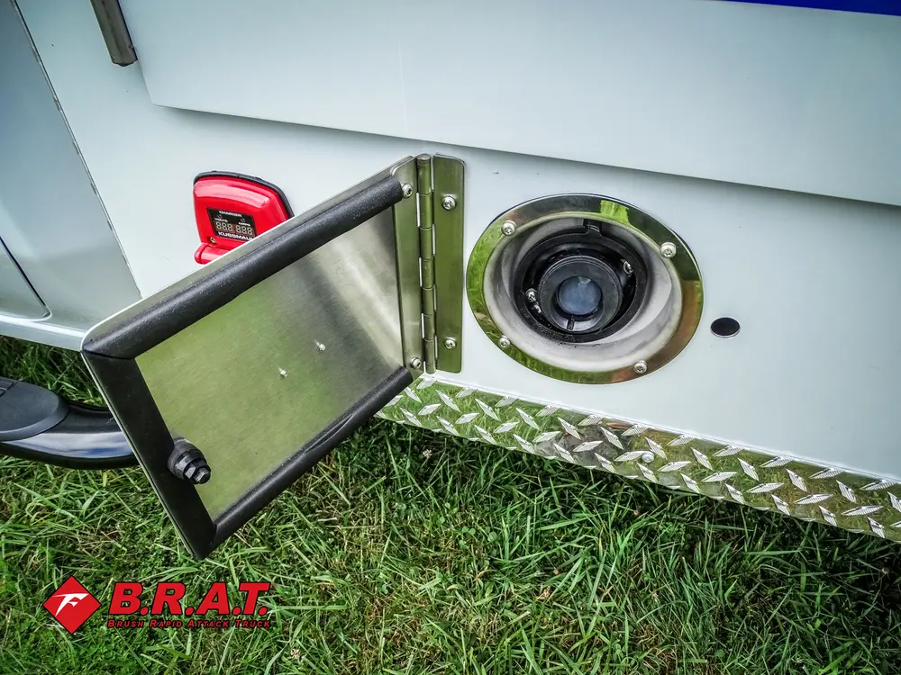 Open side utility port door with circular connector inlet.