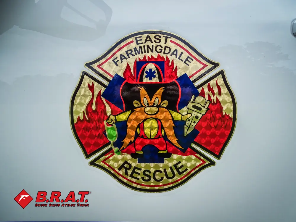 Fire department crest decal on white cab door.