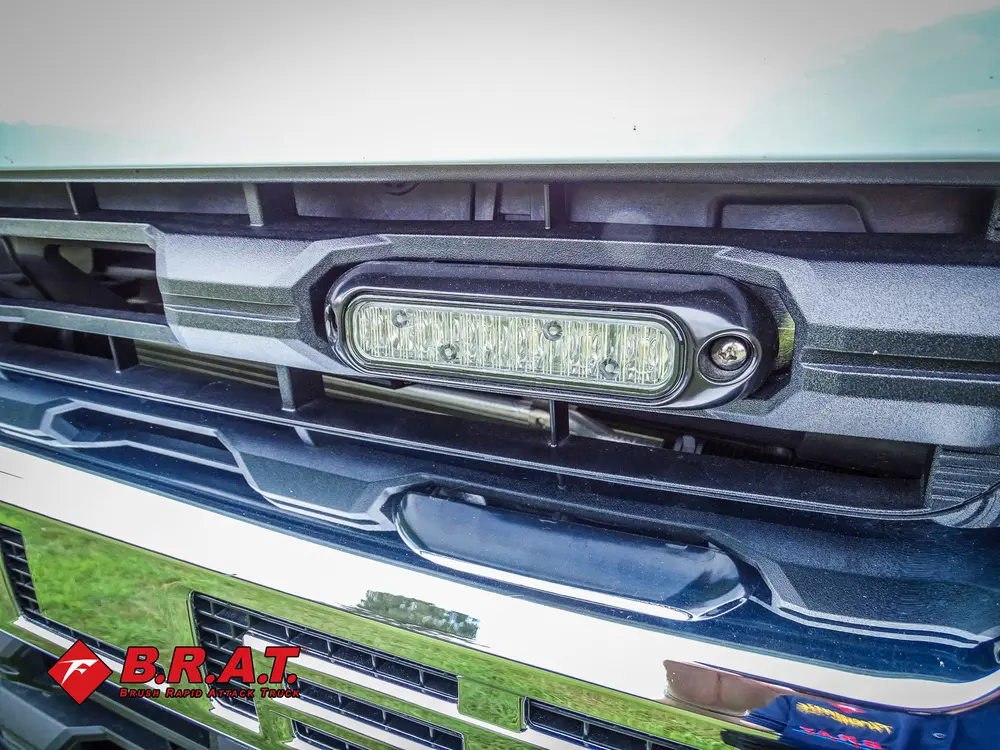 Front grille with integrated warning light close-up.