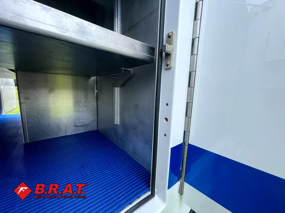 Compartment interior side shelf and blue floor corner.