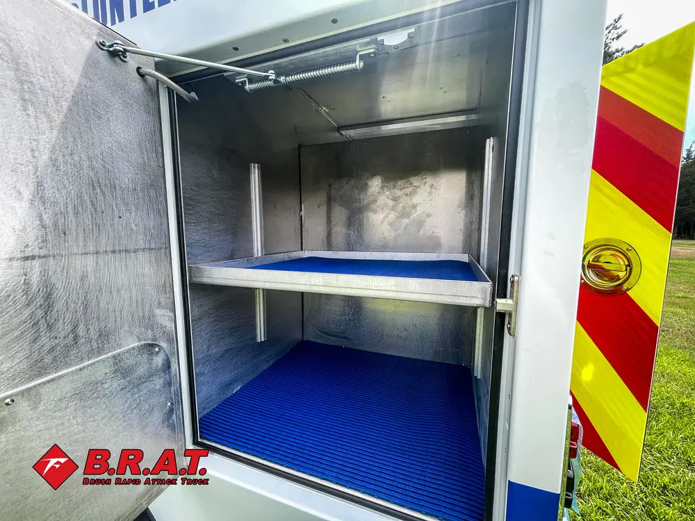 Open shelf compartment on rear body with chevron edge visible.