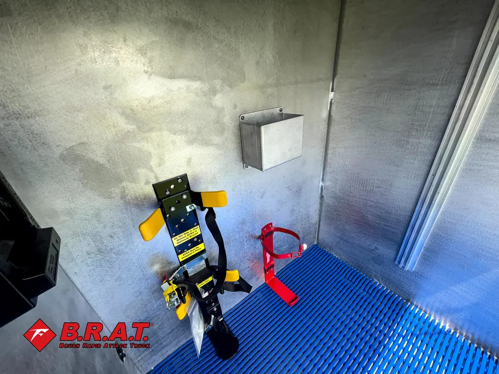 Portable tool mounts and hand tools on rear cargo floor.