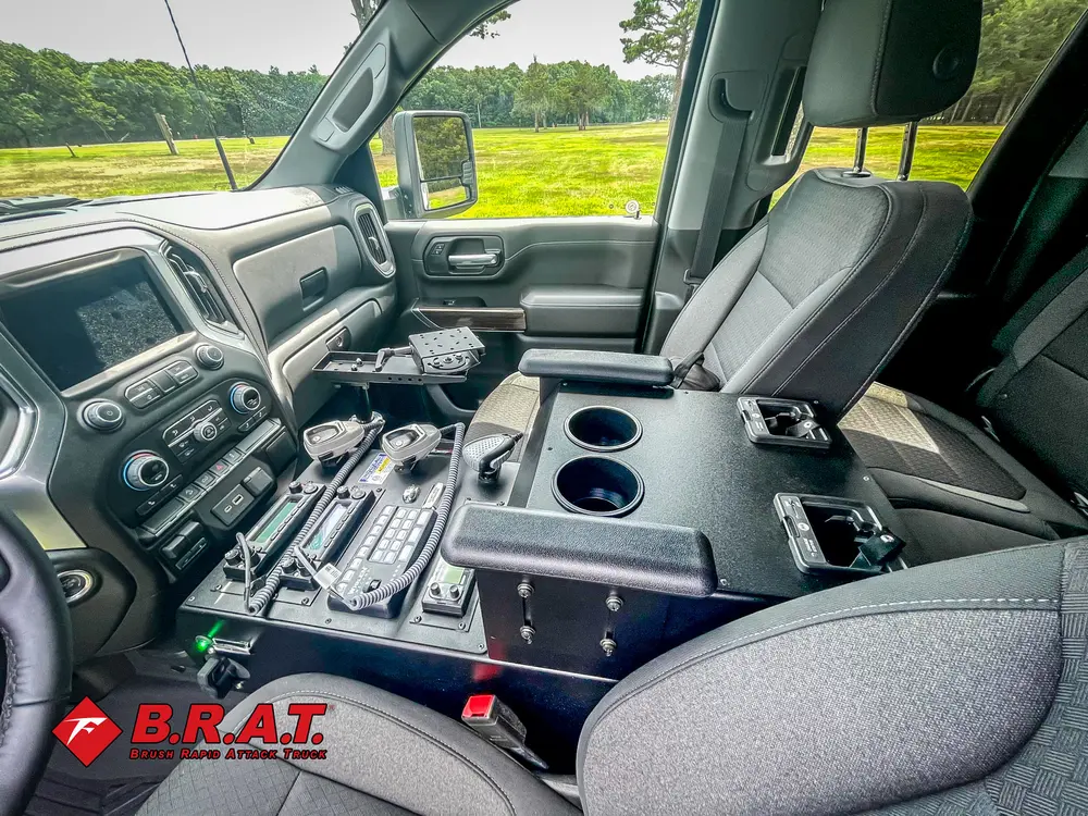 Front seats and center console with mounted control equipment.