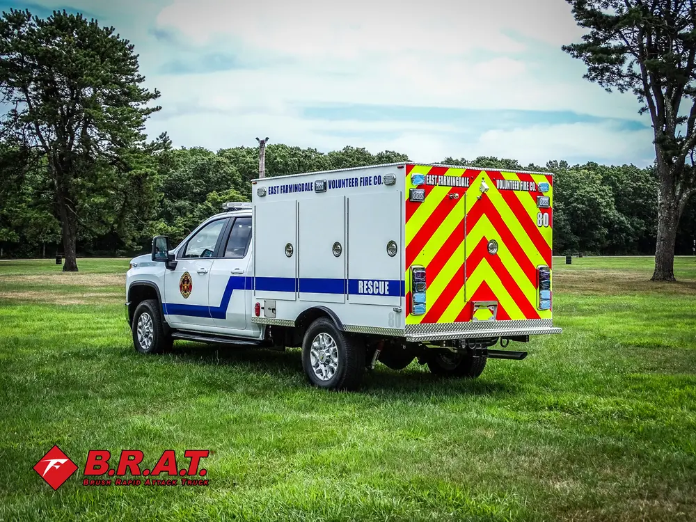 Rear driver-side three-quarter view showing taillights and body compartments.