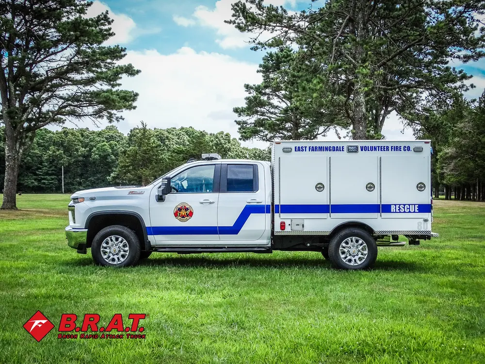 Driver-side profile with rear body and side utility doors.