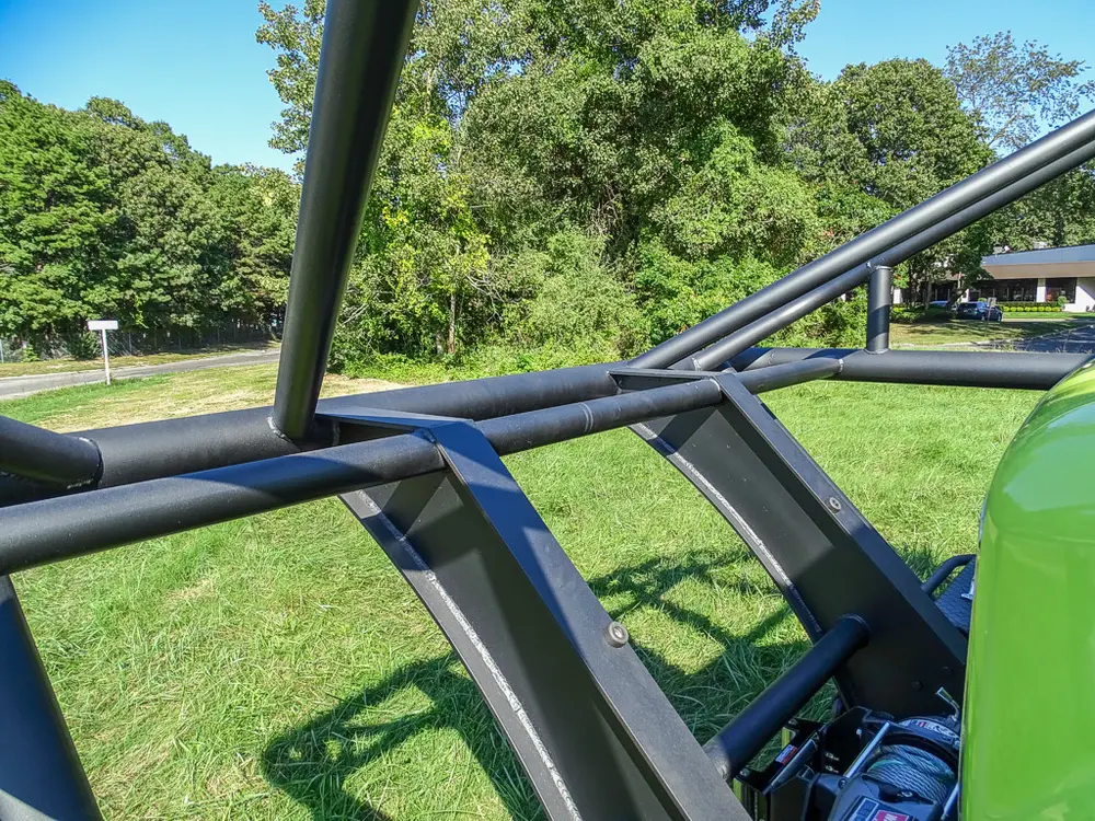 Roof cage bars and front cabin viewed from elevated rear angle.