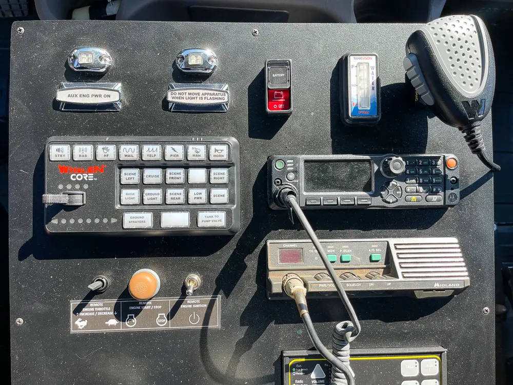 Close-up of in-cab control panel with keypad and microphone.