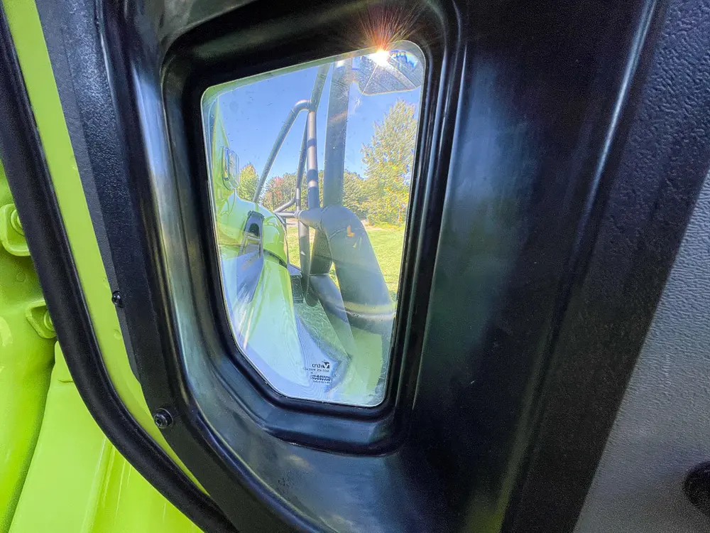 Small rear side window and interior pillar close-up.