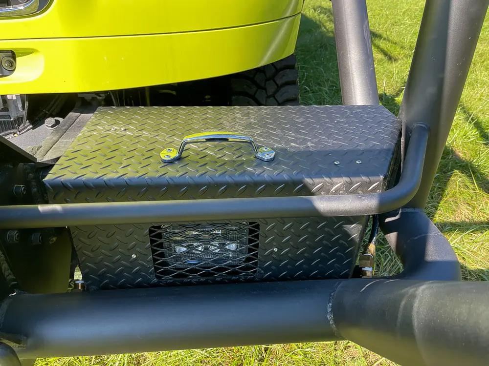 Fold-out side step platform under cab door.