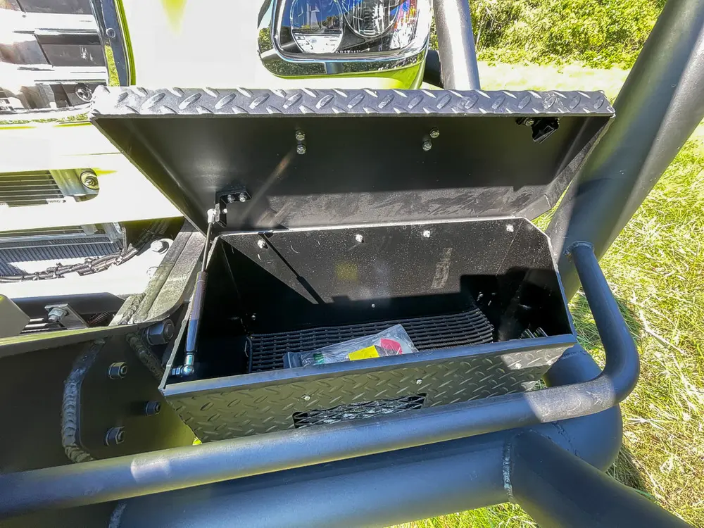 Another angle of open bumper box with latch panel.