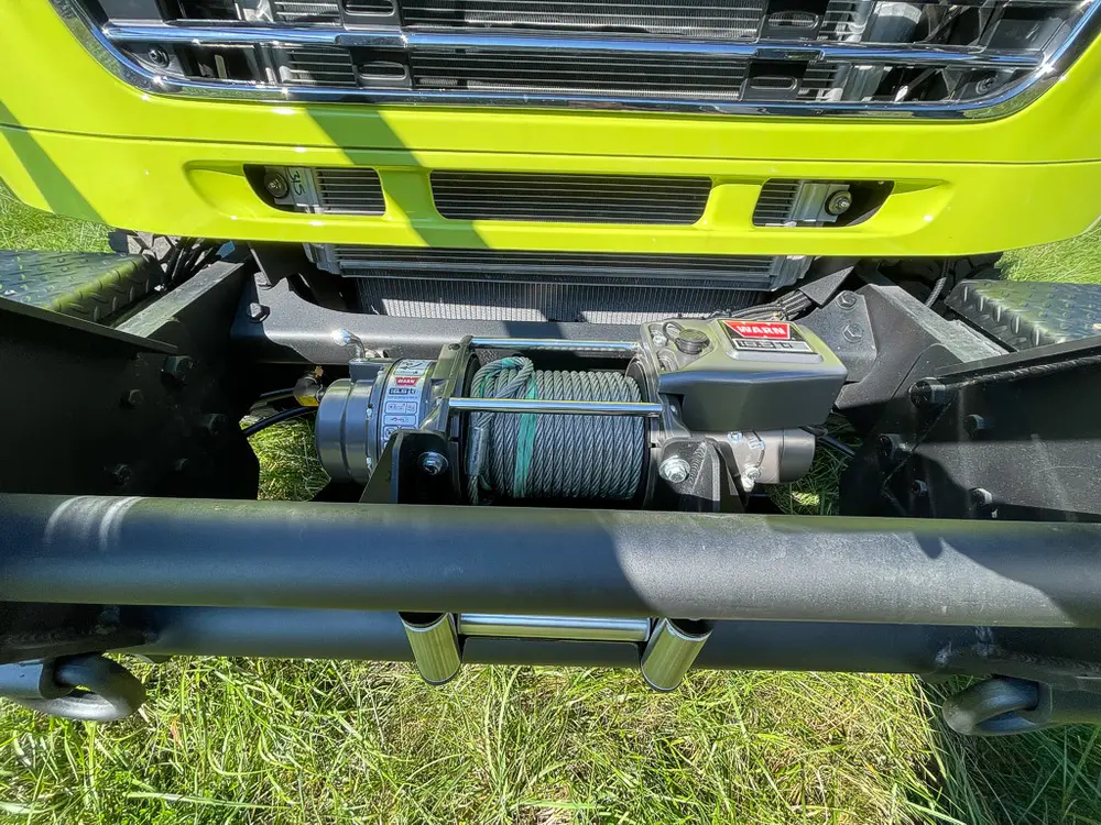 Front bumper center section with winch assembly visible.